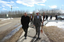 NGPS Superintendent Kevin Andrea and MLA George VanderBurg make their way to the new building site.